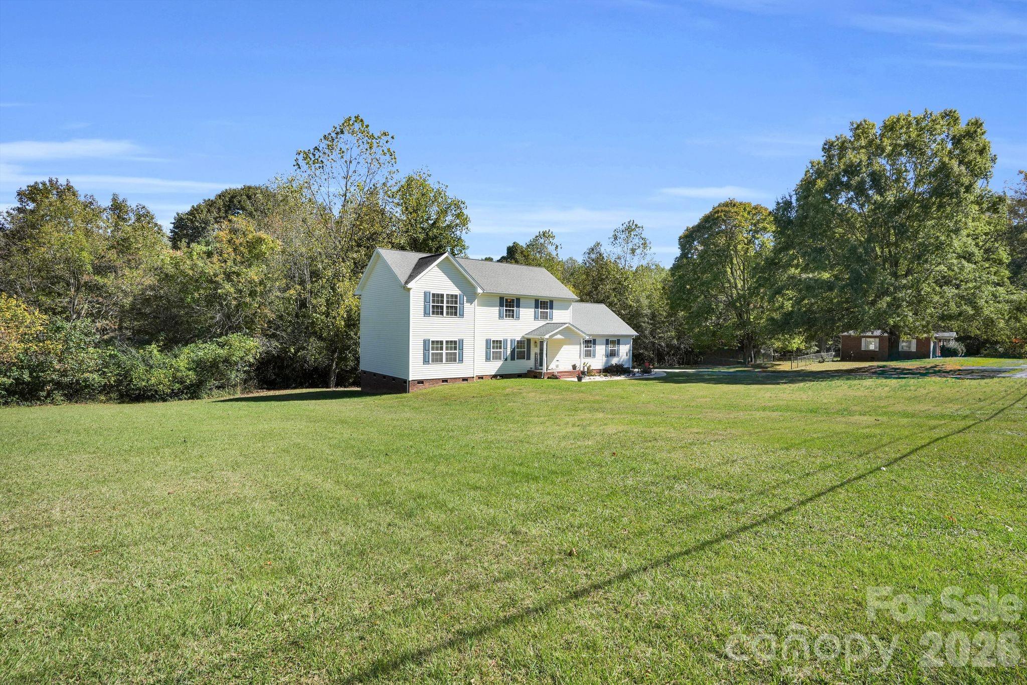 10425 Idlewild Road Matthews, NC 28105 - Photo 23 of 25 a view of a green field with house in the background