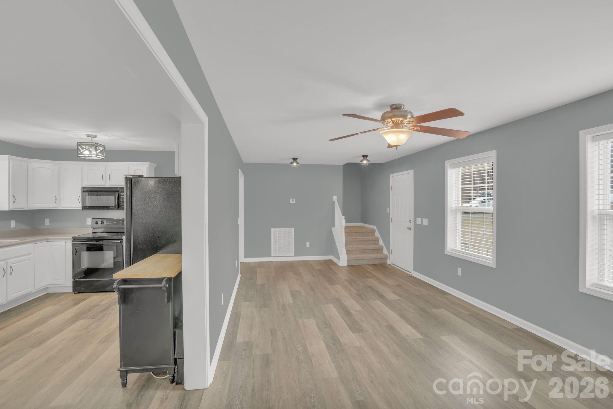 10425 Idlewild Road Matthews, NC 28105 - Photo 4 of 25 a view of a kitchen with a sink cabinets and outdoor space