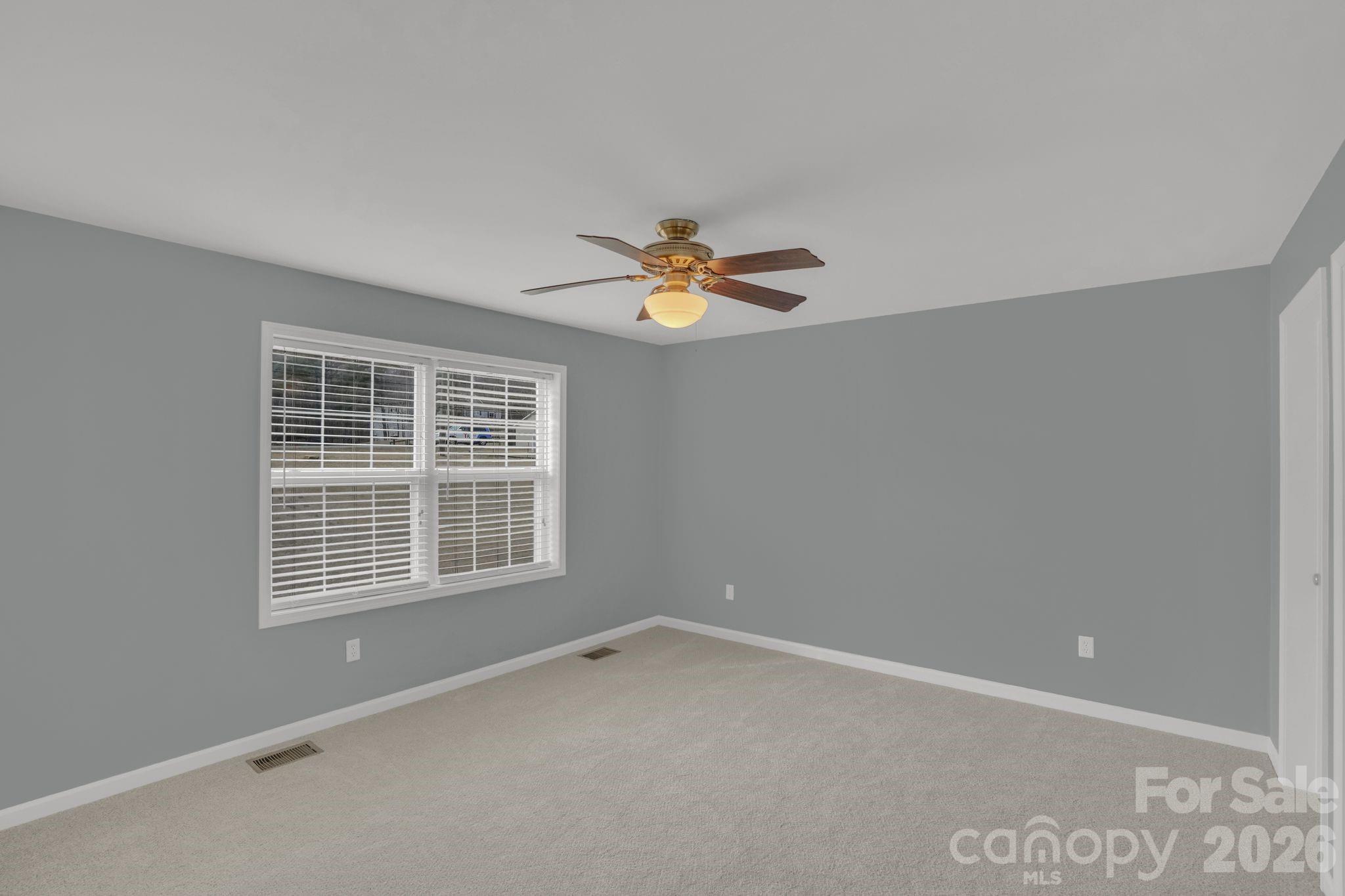 10425 Idlewild Road Matthews, NC 28105 - Photo 9 of 25 a view of an empty room with a window
