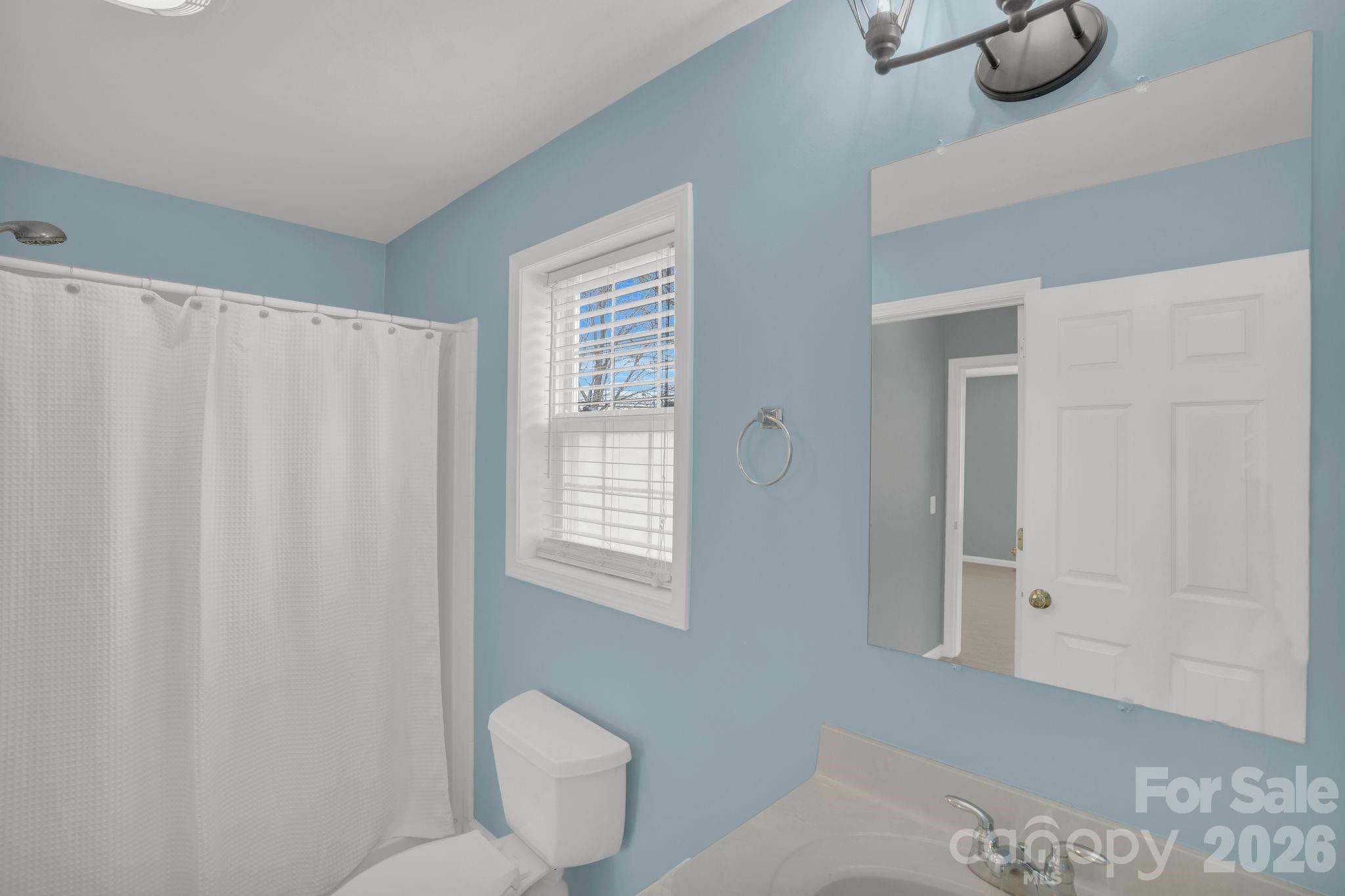 10425 Idlewild Road Matthews, NC 28105 - Photo 10 of 25 a bathroom with a toilet tub and shower