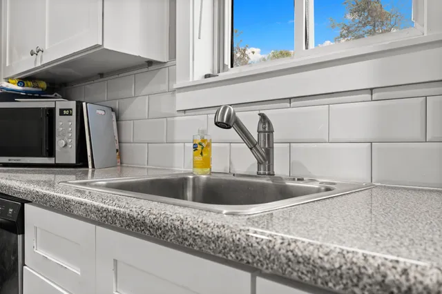 a view bathroom with a sink and a mirror
