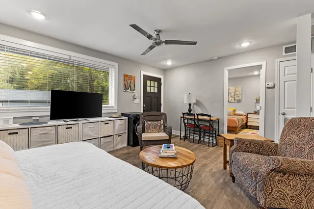 a living room with furniture and a flat screen tv