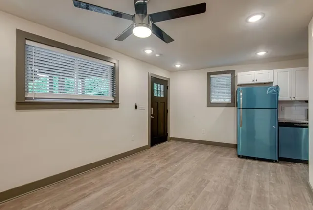 a view of an empty room with a window