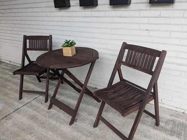 a view of a outdoor seating area with wooden table