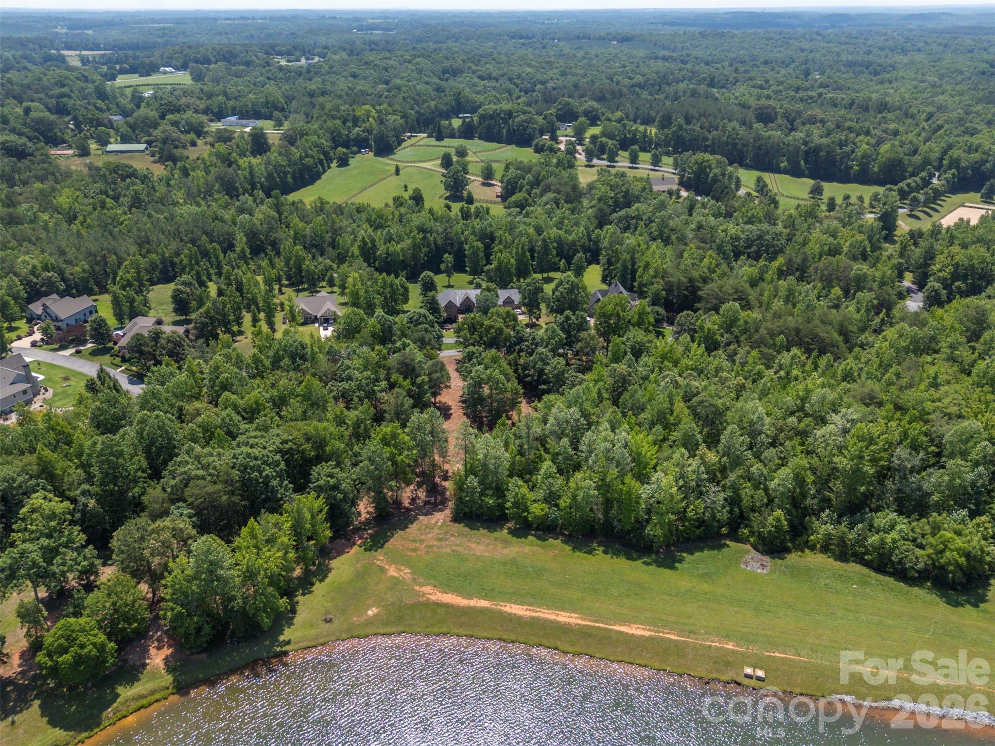 0 Doveridge Drive, Unit 66 Tryon, NC 28782 - Photo 8 of 21 an aerial view of a houses with a yard