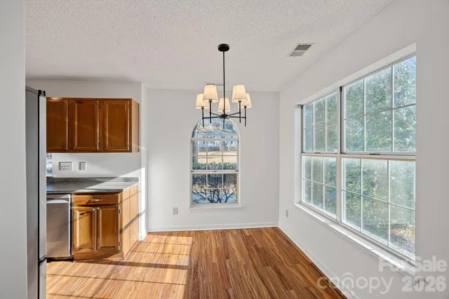 a kitchen that has a lot of windows in it