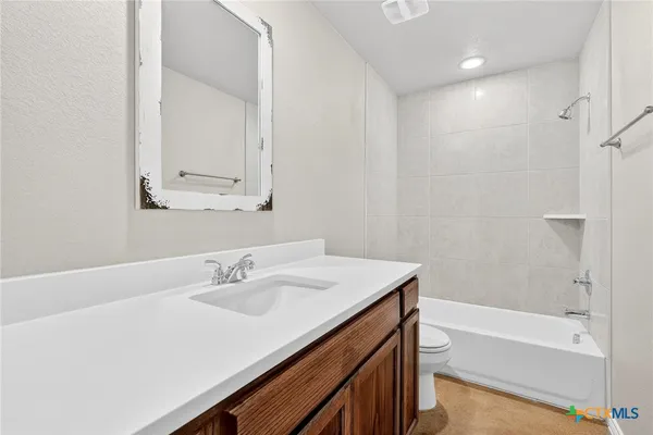 a bathroom with a sink a bathtub and a shower