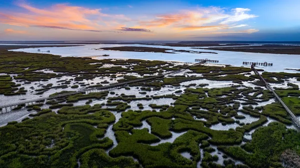 a view of an swimming pool with an outdoor space and seating area