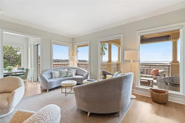 a kitchen with stainless steel appliances kitchen island granite countertop a table and chairs in it