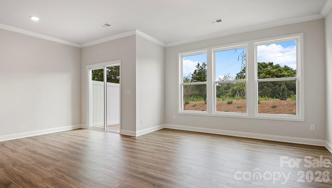 384 Creekview Road Hendersonville, NC 28792 - Photo 12 of 22 a view of a livingroom with wooden floor and a window