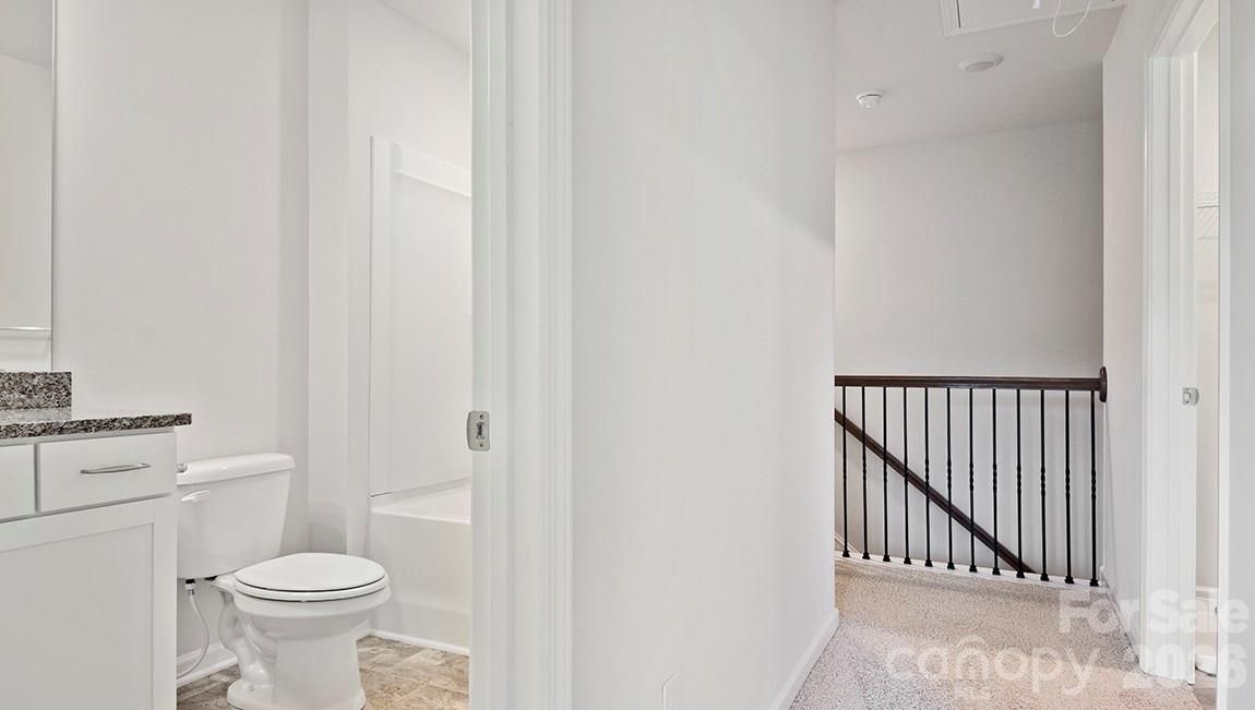 384 Creekview Road Hendersonville, NC 28792 - Photo 16 of 22 a bathroom with a toilet and a sink