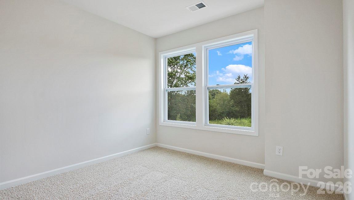384 Creekview Road Hendersonville, NC 28792 - Photo 20 of 22 an empty room with a window