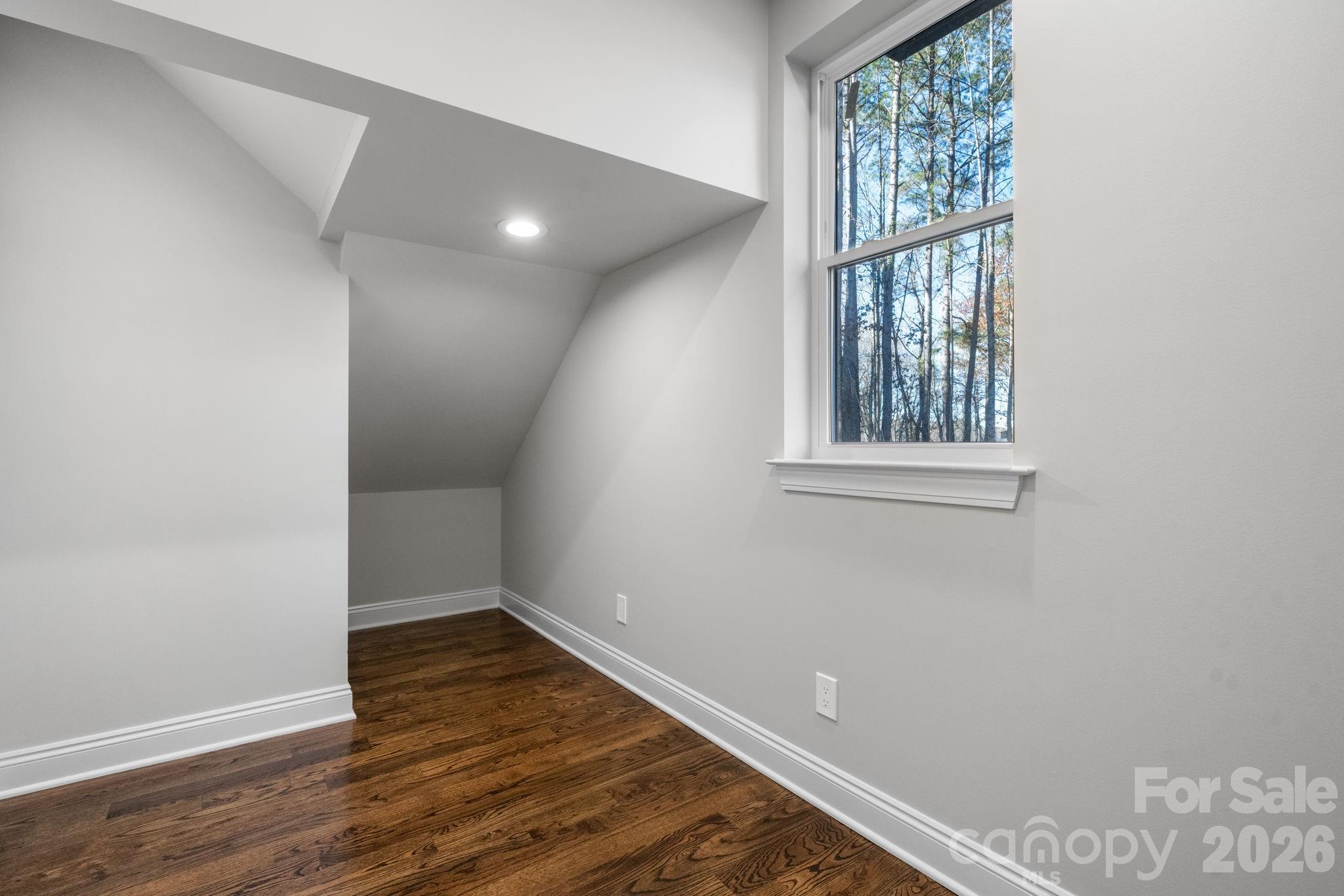 5163 Hurricane Hill Road Granite Falls, NC 28630 - Photo 17 of 40 an empty room with wooden floor and windows