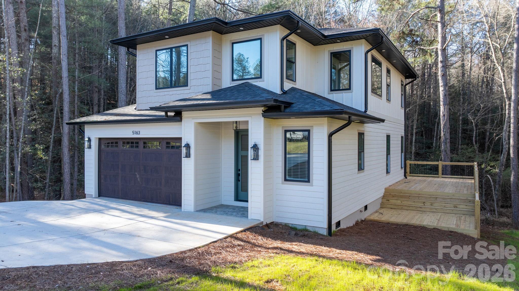 5163 Hurricane Hill Road Granite Falls, NC 28630 - Photo 2 of 40 a front view of a house with a yard and garage