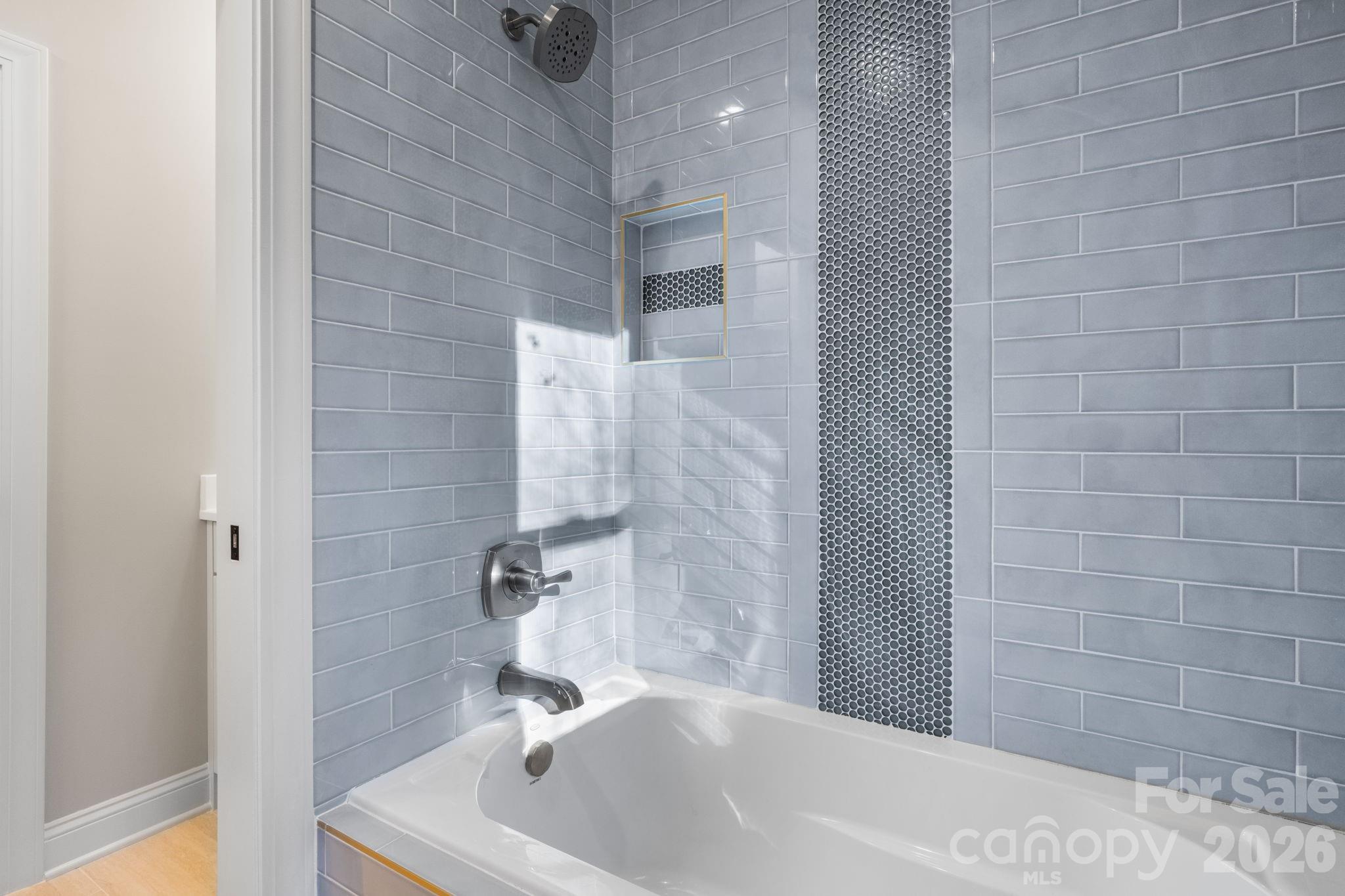 5163 Hurricane Hill Road Granite Falls, NC 28630 - Photo 25 of 40 a bathroom with a white bath tub a shower and a sink