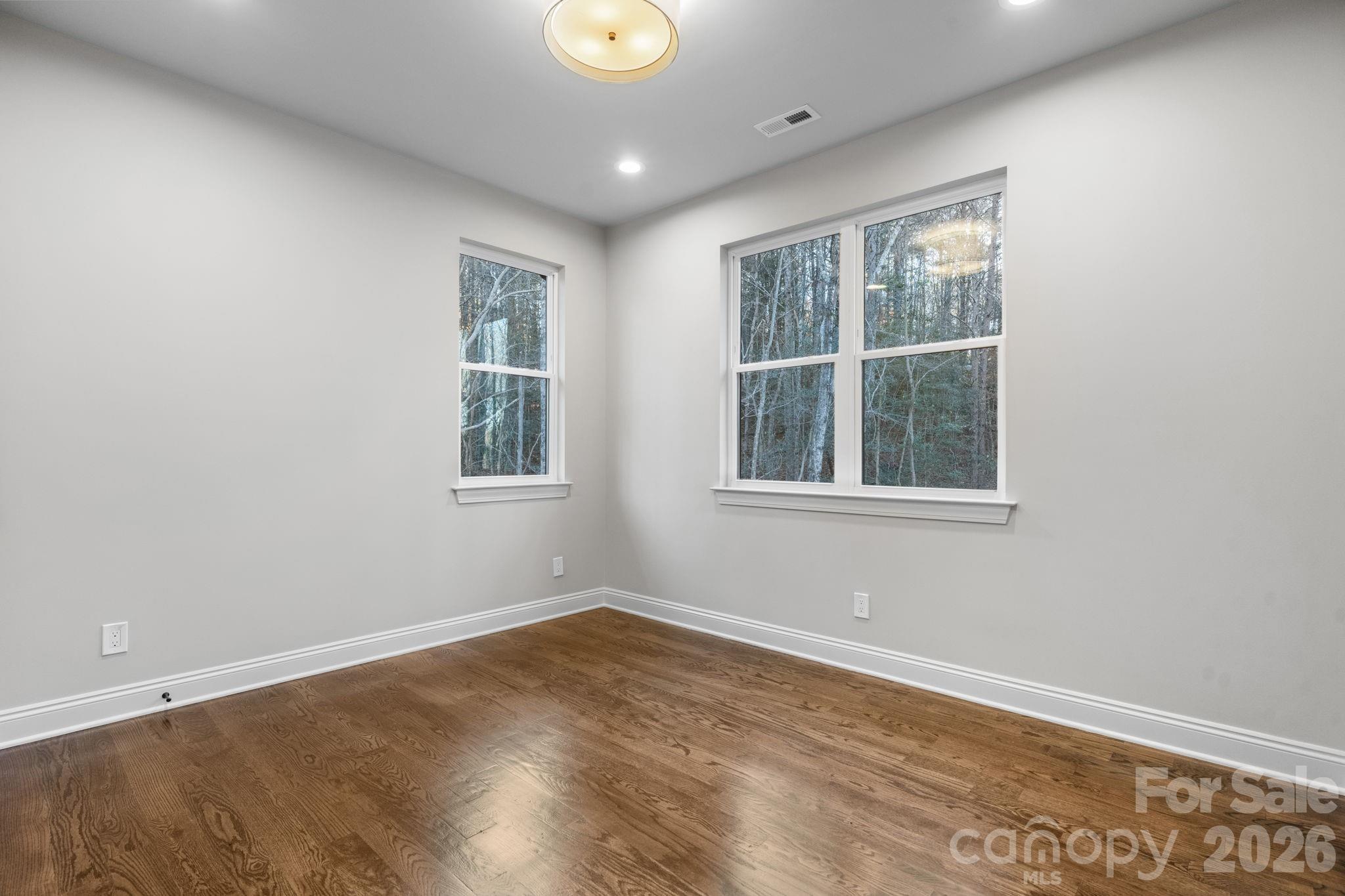 5163 Hurricane Hill Road Granite Falls, NC 28630 - Photo 27 of 40 a view of empty room with wooden floor and fan