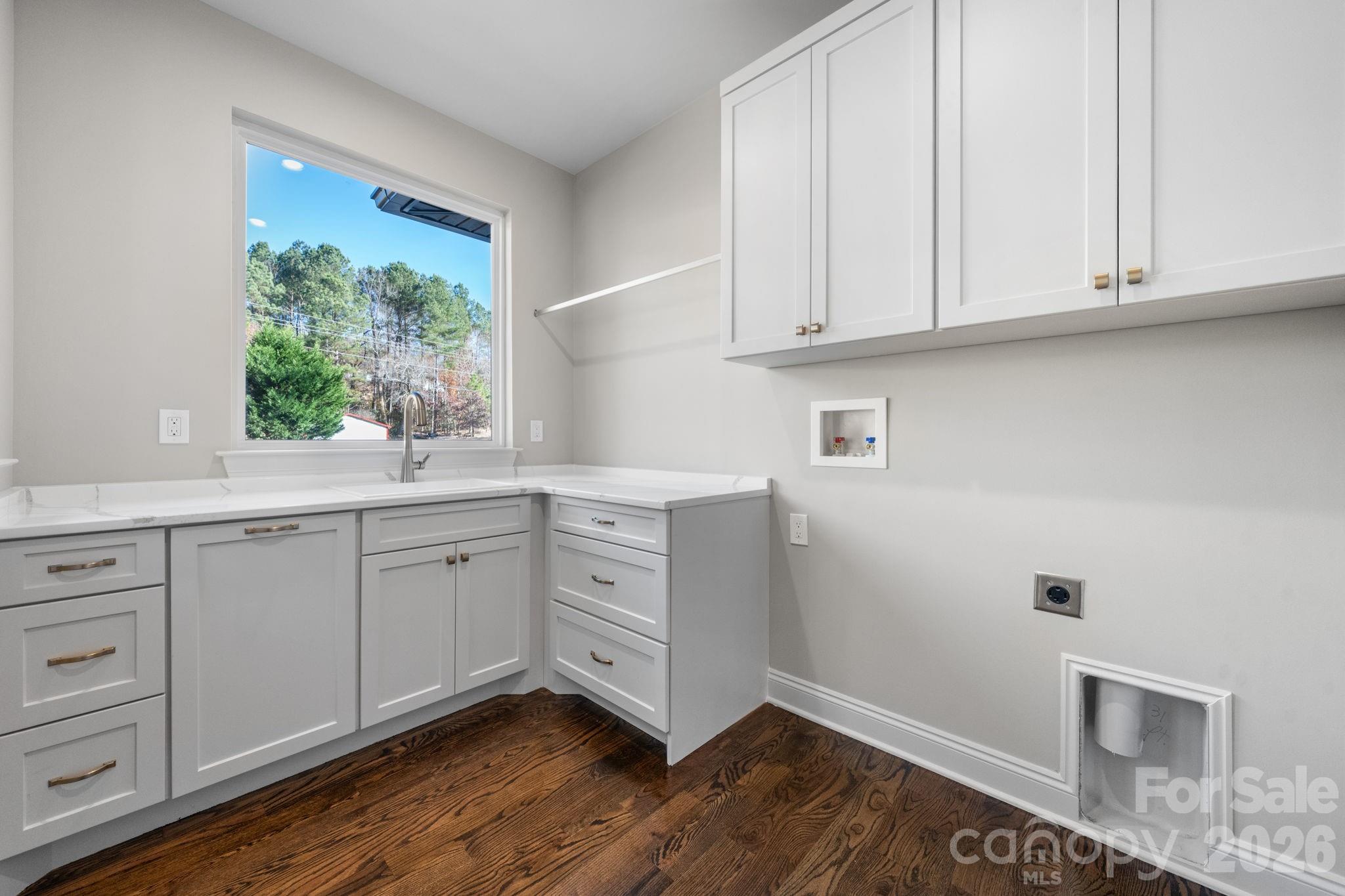 5163 Hurricane Hill Road Granite Falls, NC 28630 - Photo 28 of 40 a kitchen with white cabinets and sink
