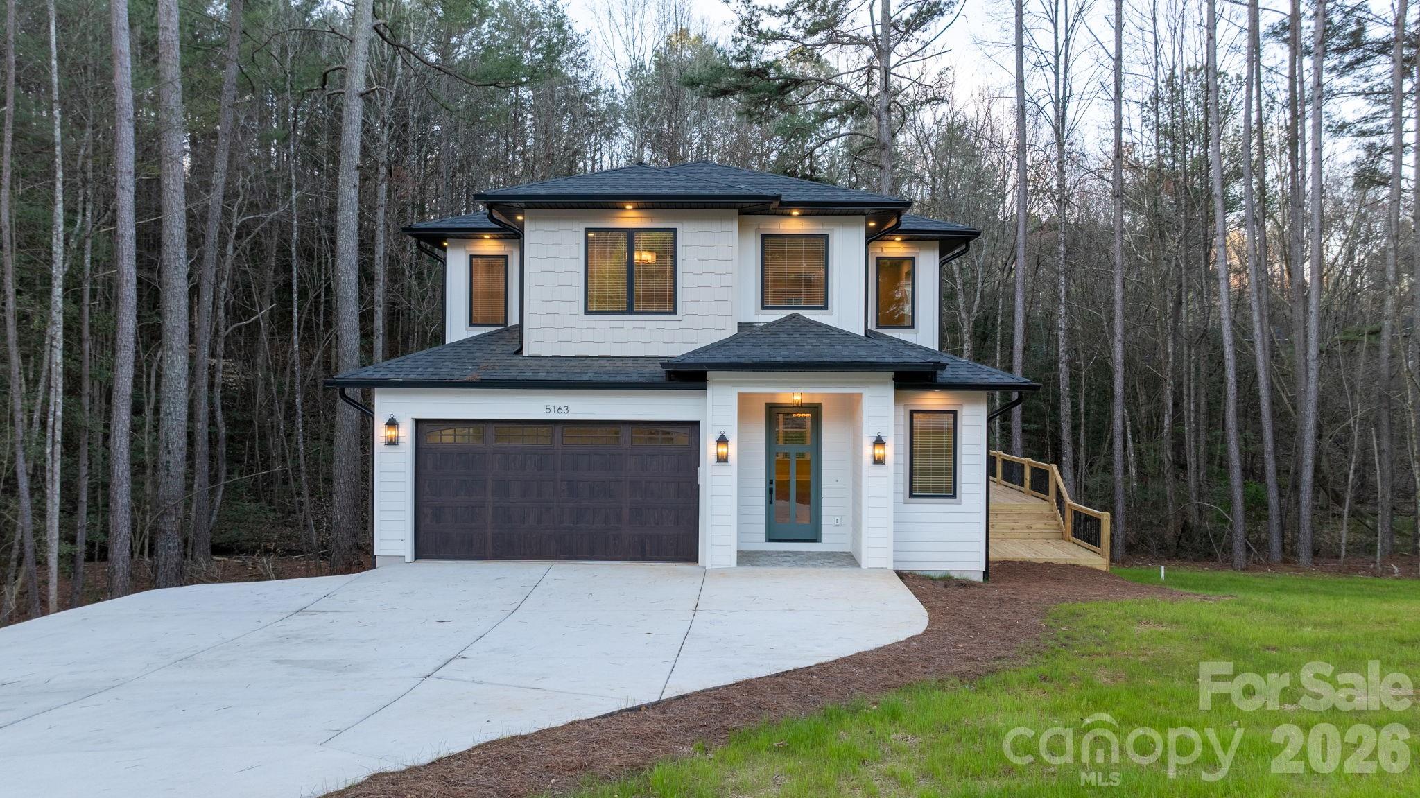 5163 Hurricane Hill Road Granite Falls, NC 28630 - Photo 31 of 40 a front view of a house with a yard and garage