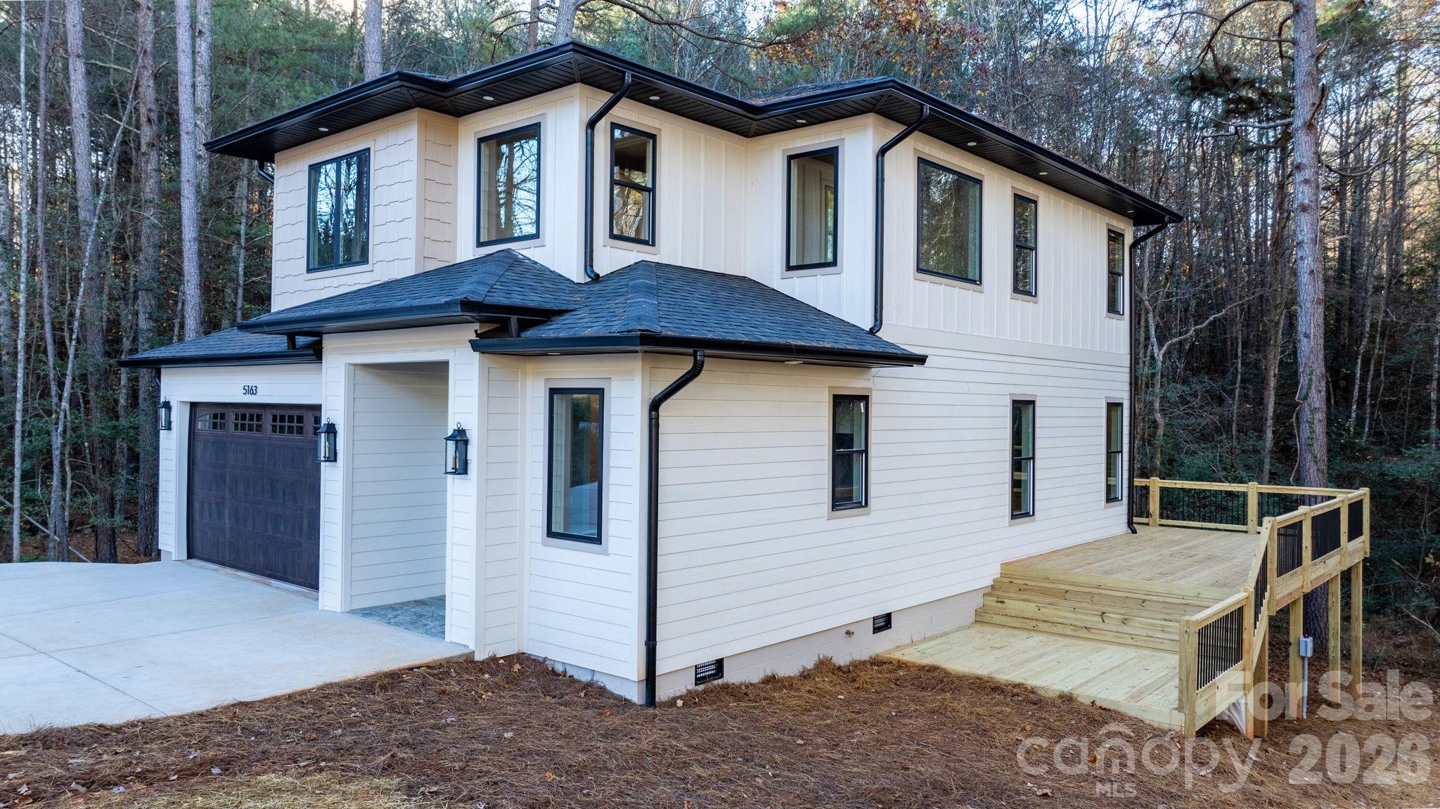 5163 Hurricane Hill Road Granite Falls, NC 28630 - Photo 32 of 40 a view of a house with a yard and wooden fence
