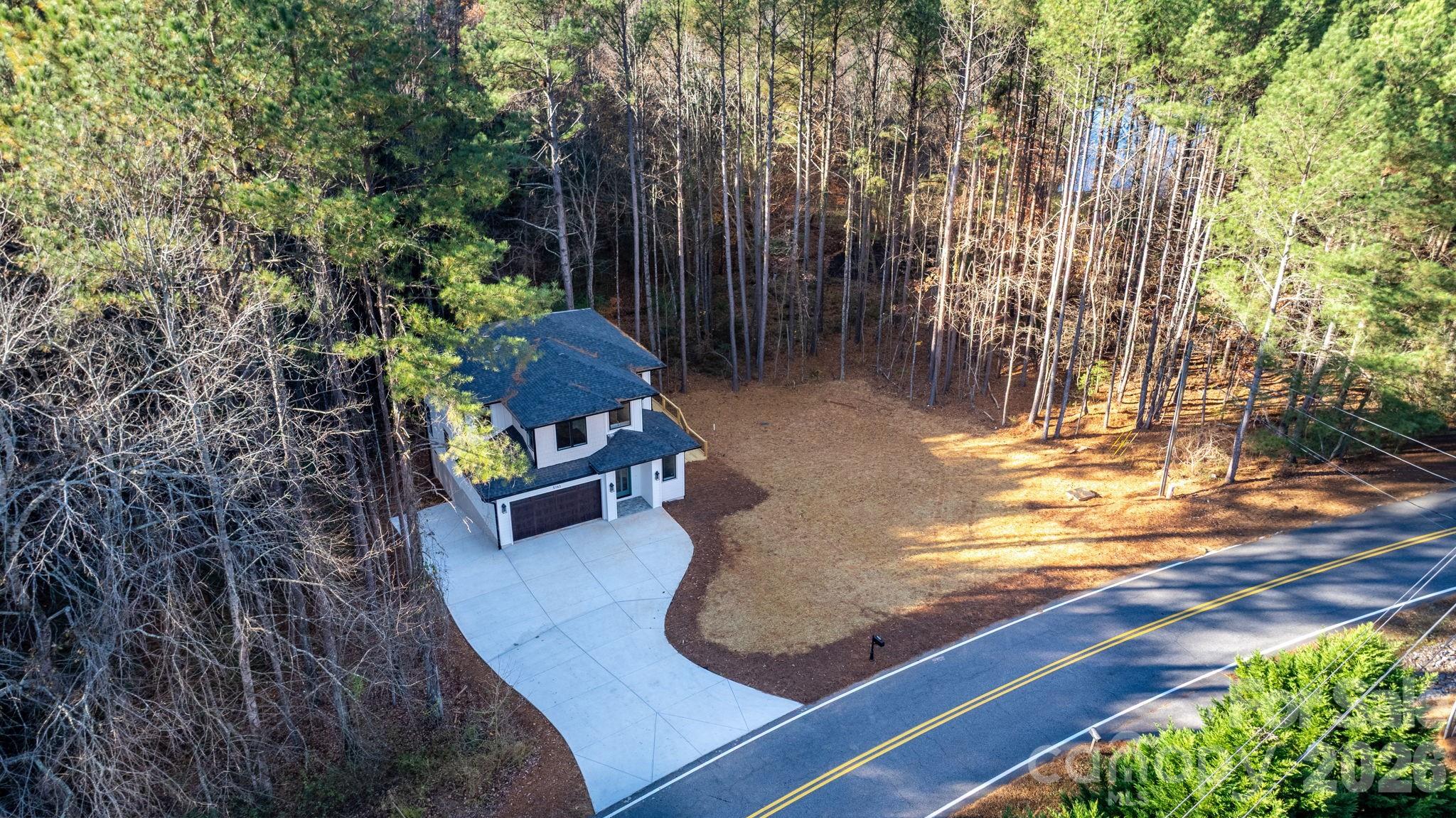 5163 Hurricane Hill Road Granite Falls, NC 28630 - Photo 38 of 40 a view of a garden with an outdoor space