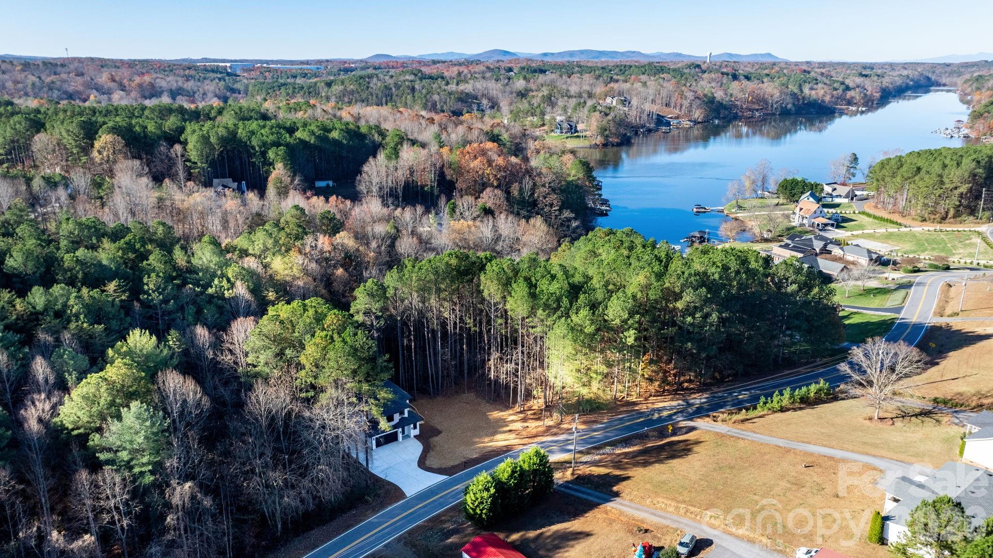 5163 Hurricane Hill Road Granite Falls, NC 28630 - Photo 39 of 40 a view of a lake with a mountain