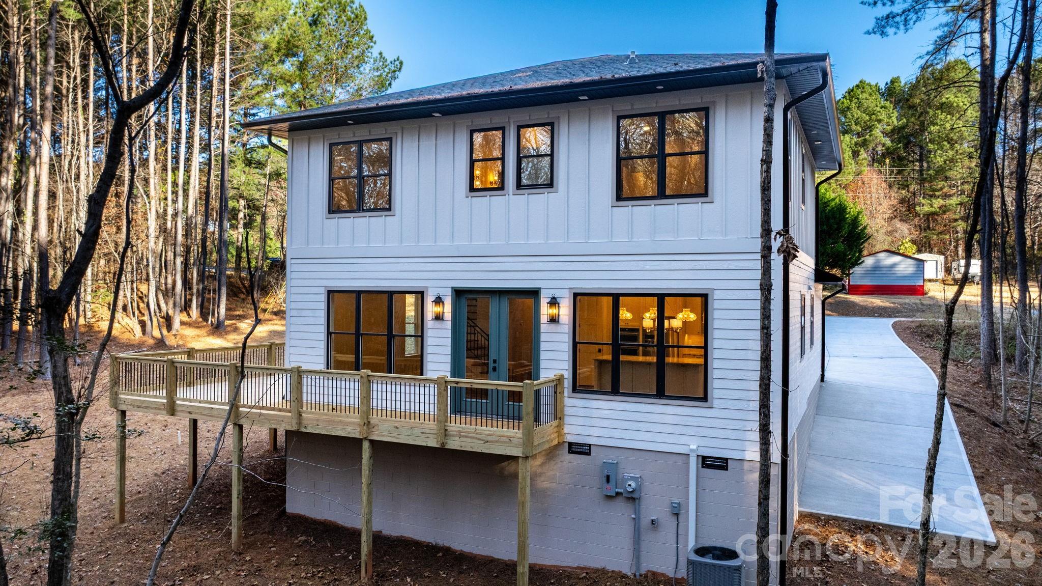 5163 Hurricane Hill Road Granite Falls, NC 28630 - Photo 5 of 40 a front view of a house with outdoor seating