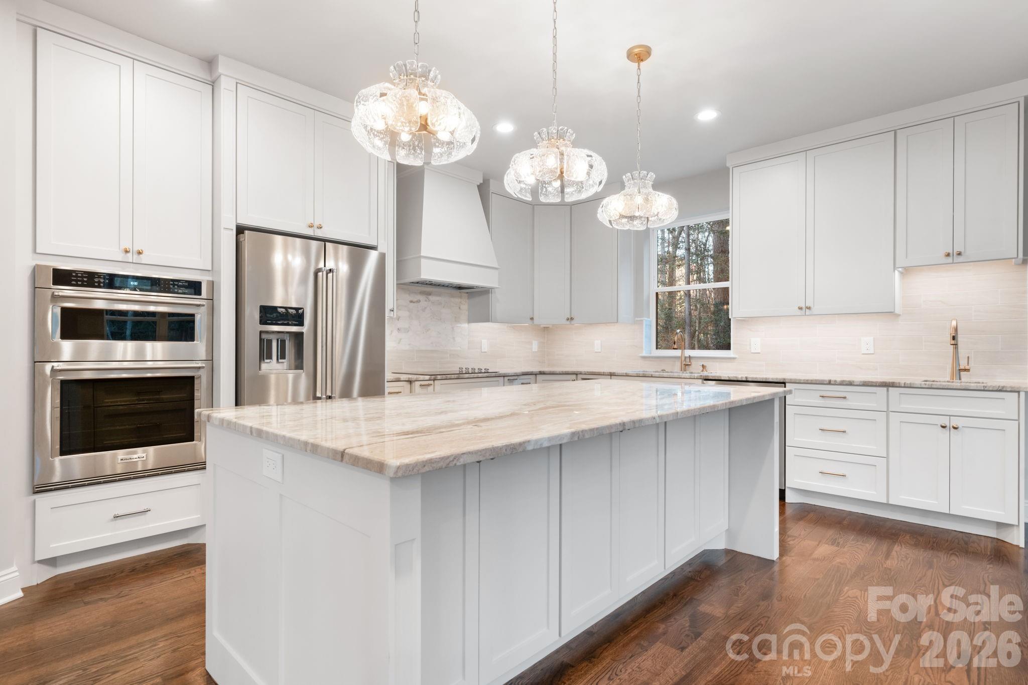 5163 Hurricane Hill Road Granite Falls, NC 28630 - Photo 7 of 40 a kitchen with a sink stainless steel appliances and chandelier