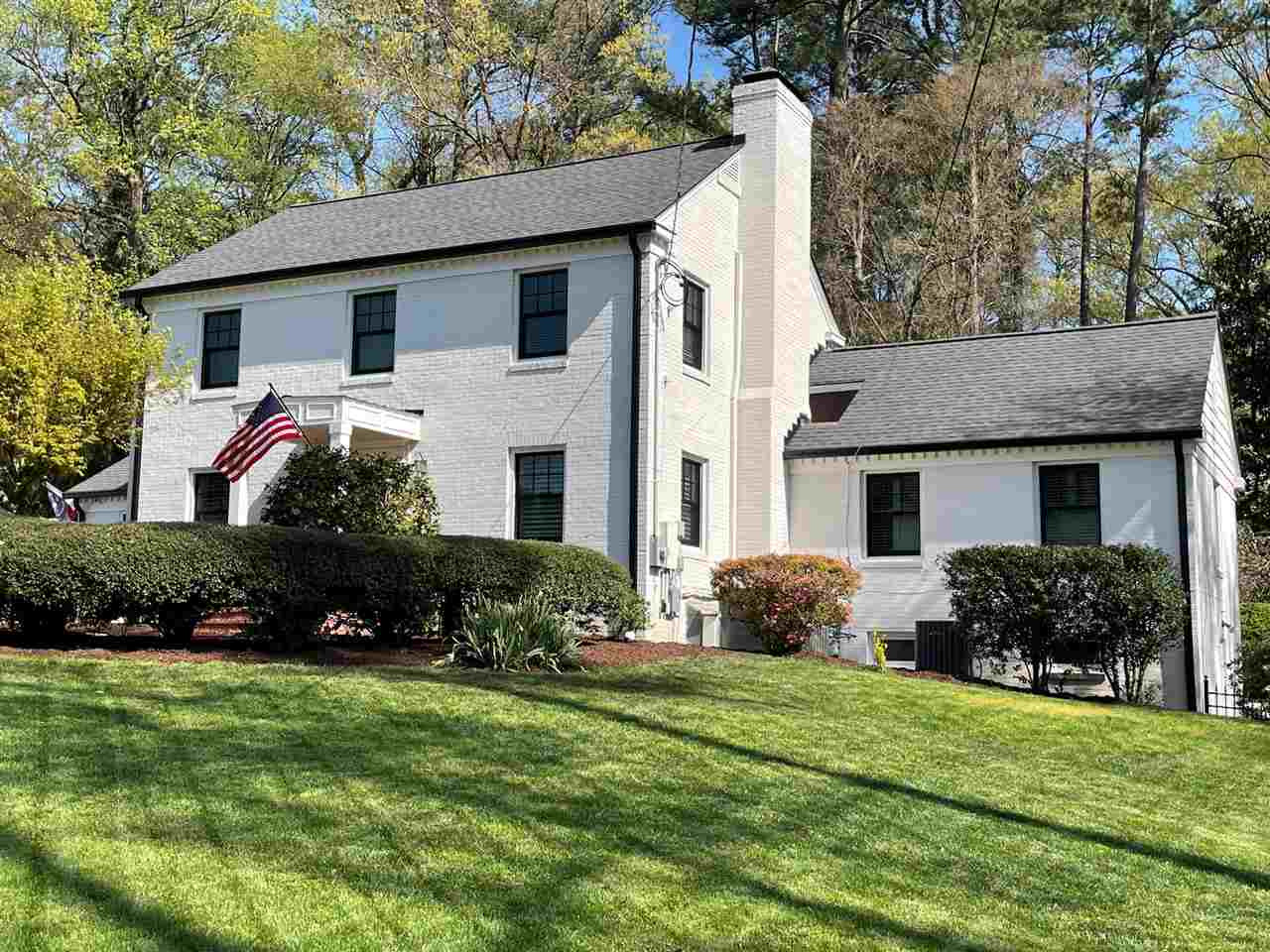 3613 Hathaway Road Durham, NC 27707 - Photo 1 of 24 a front view of a house with a garden and plants