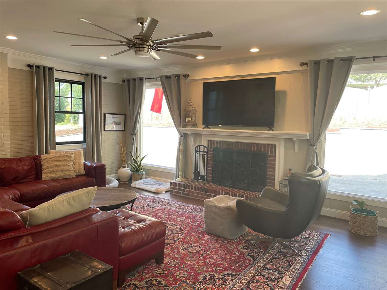3613 Hathaway Road Durham, NC 27707 - Photo 13 of 24 a living room with furniture a large window and a fireplace