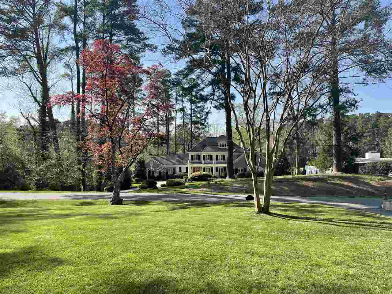 3613 Hathaway Road Durham, NC 27707 - Photo 8 of 24 a view of a swimming pool with lawn chairs and trees