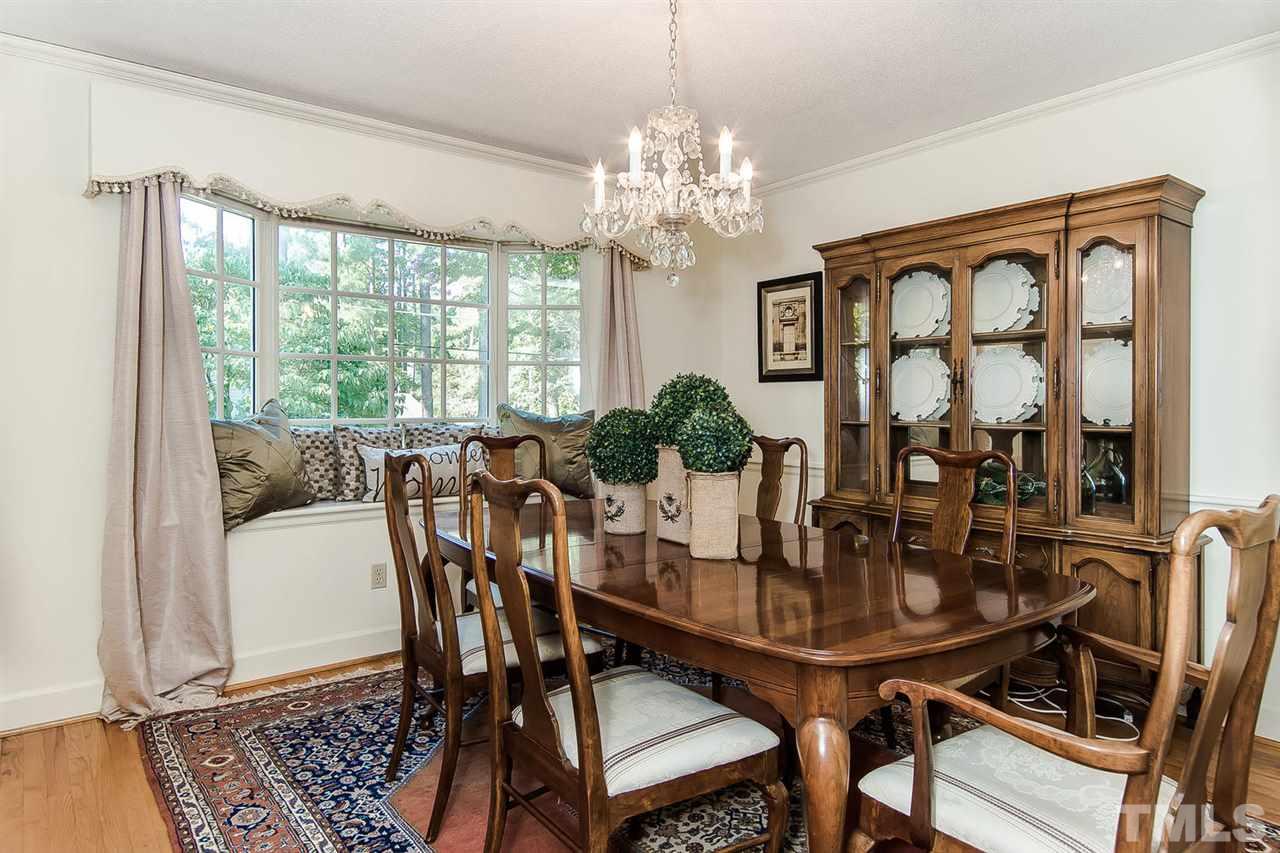 6412 Brandywine Road Raleigh, NC 27607 - Photo 13 of 25 a view of a dining room with furniture window and outside view