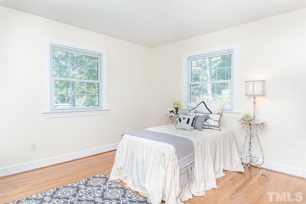 6412 Brandywine Road Raleigh, NC 27607 - Photo 19 of 25 a bedroom with a bed and a window