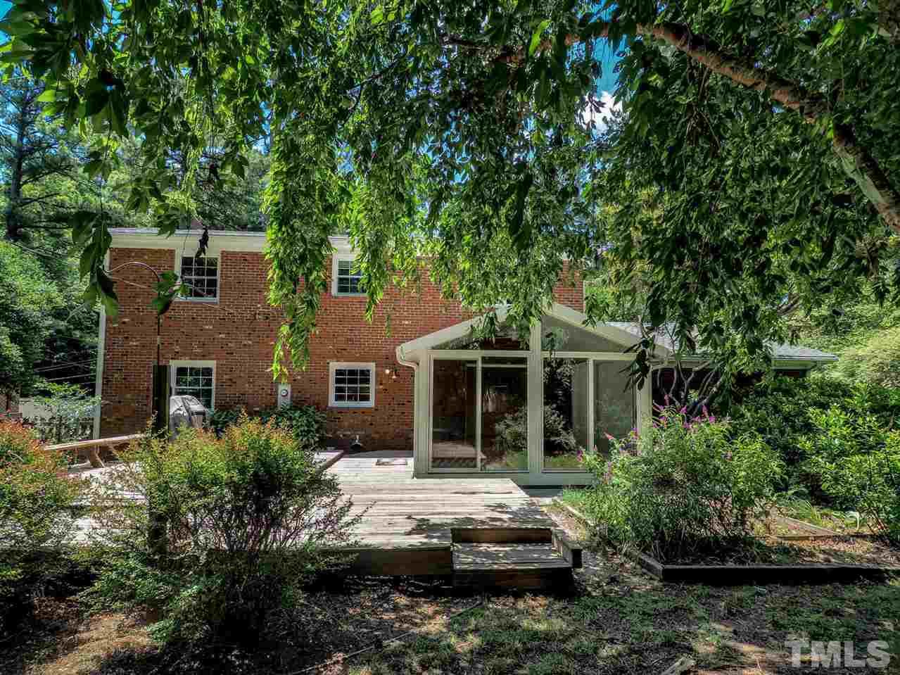 6412 Brandywine Road Raleigh, NC 27607 - Photo 21 of 25 a front view of a house with a garden