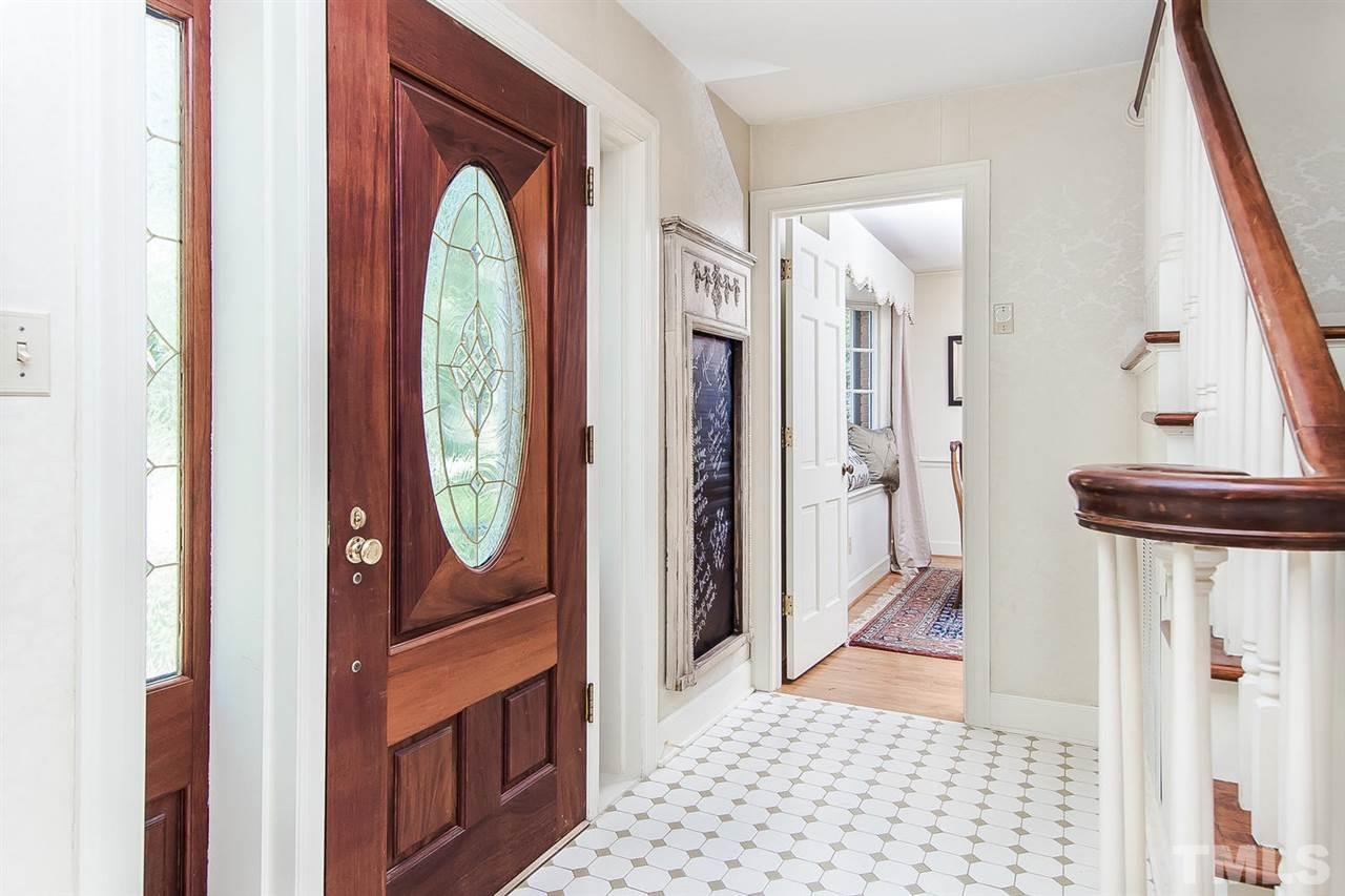 6412 Brandywine Road Raleigh, NC 27607 - Photo 4 of 25 a view of a hallway with windows and stairs