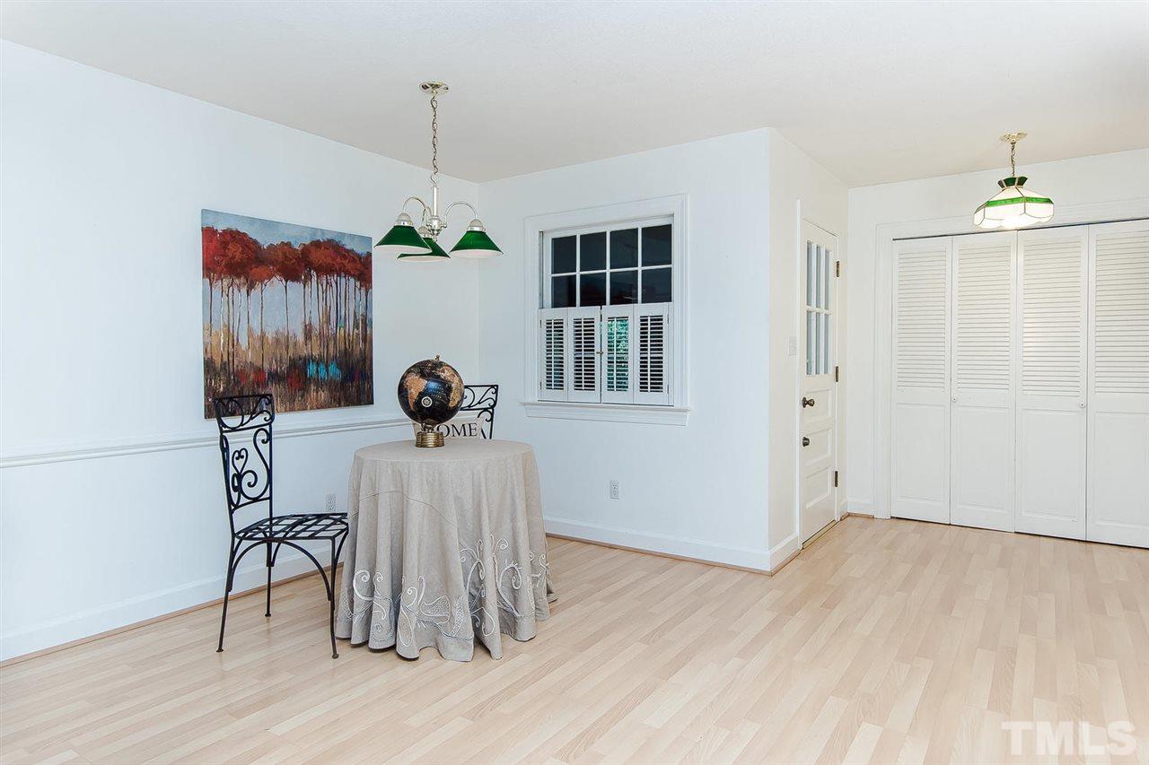 6412 Brandywine Road Raleigh, NC 27607 - Photo 10 of 25 a view of a room with wooden floor table and chairs