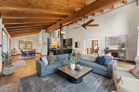 a living room with furniture rug and white walls