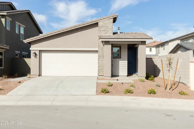 a front view of a house with a garage