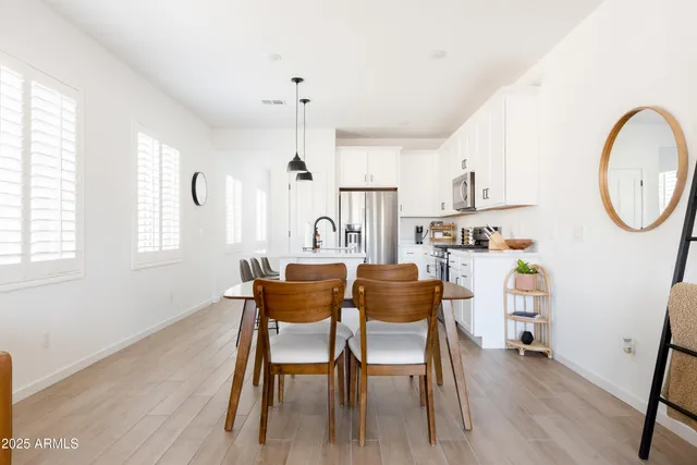 a dining room with furniture and window