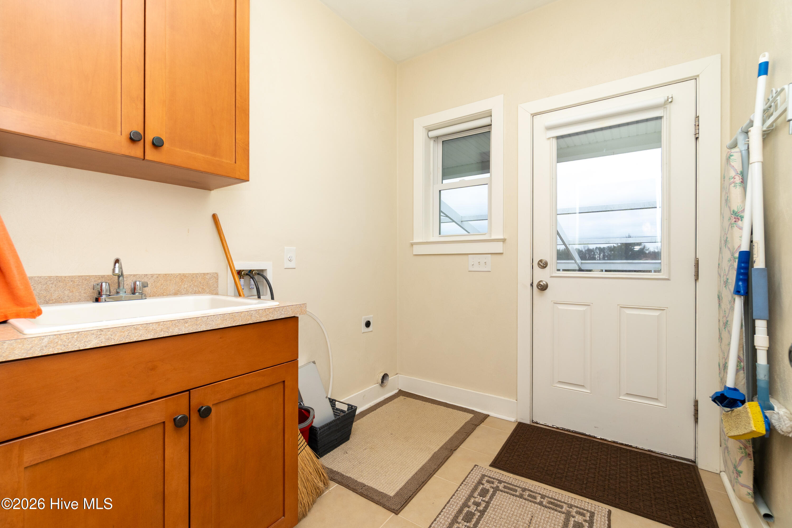 337 Woodleigh Road Knotts Island, NC 27950 - Photo 29 of 75 Laundrey Room with Utility Sink