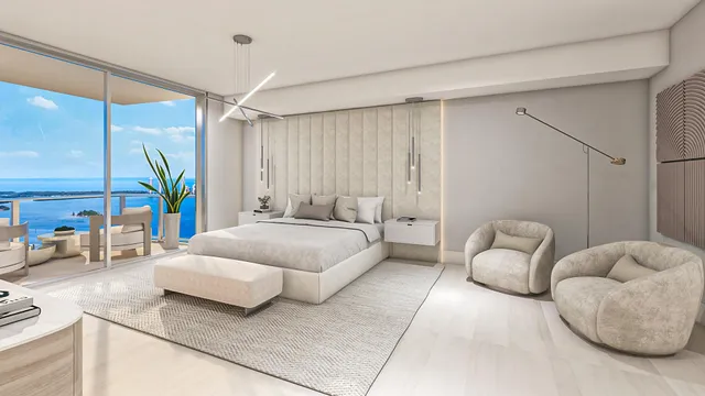 a bedroom with a bed couch and a window