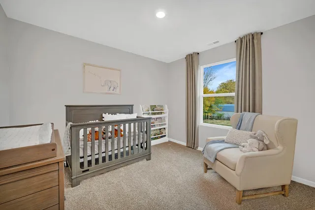 a bedroom with furniture and a window