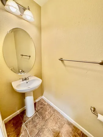 a bathroom with a sink and mirror