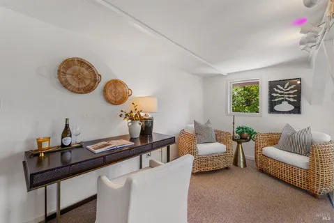 a living room with furniture and a table