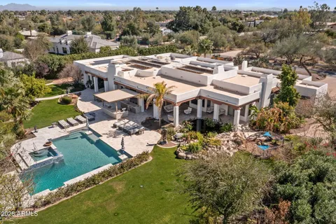 an aerial view of a house with a garden