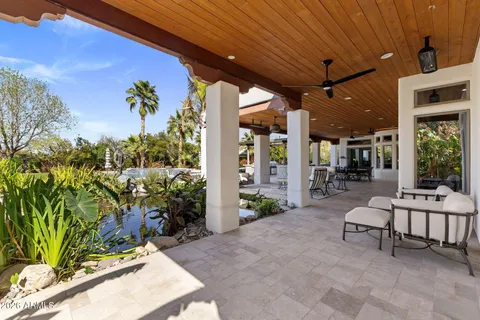 a building outdoor space with patio furniture and potted plants