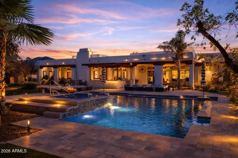 a view of swimming pool with outdoor seating