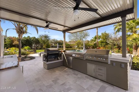 a view of a patio with a table and chairs