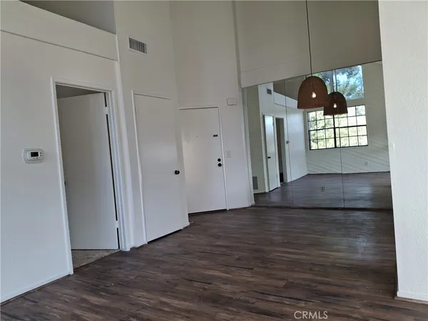a view of livingroom with hardwood floor and hallway