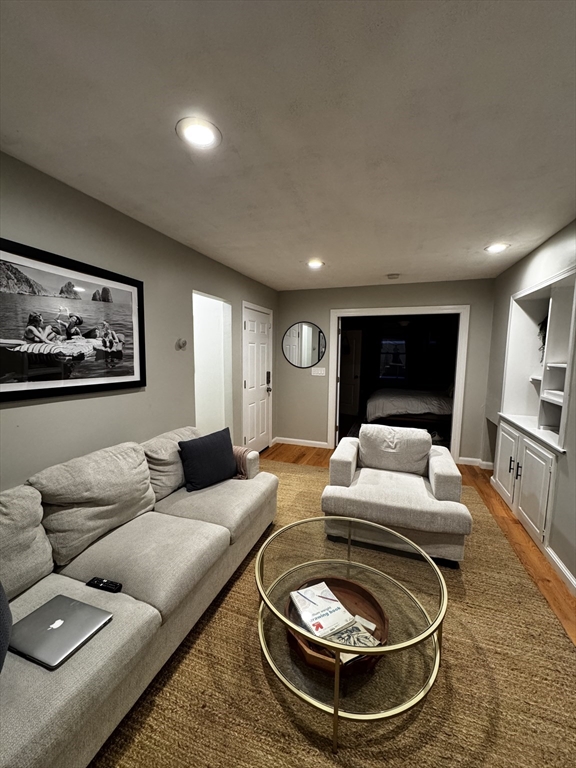 83 Chelsea Street, Unit 2 Boston, MA 02128 - Photo 3 of 7 a living room with furniture and a rug