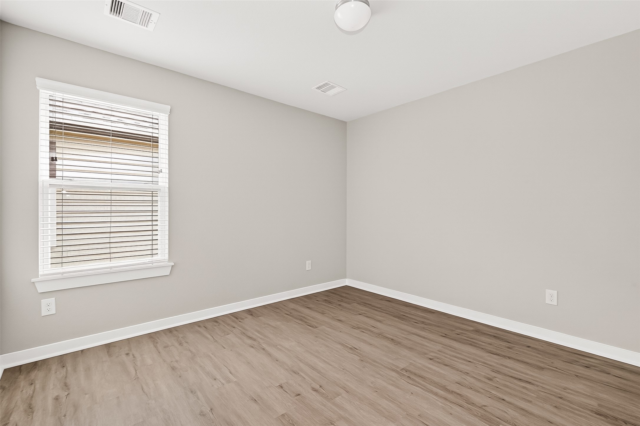 2142 Reed Cave Lane Spring, TX 77386 - Photo 36 of 50 wooden floor in an empty room with a window